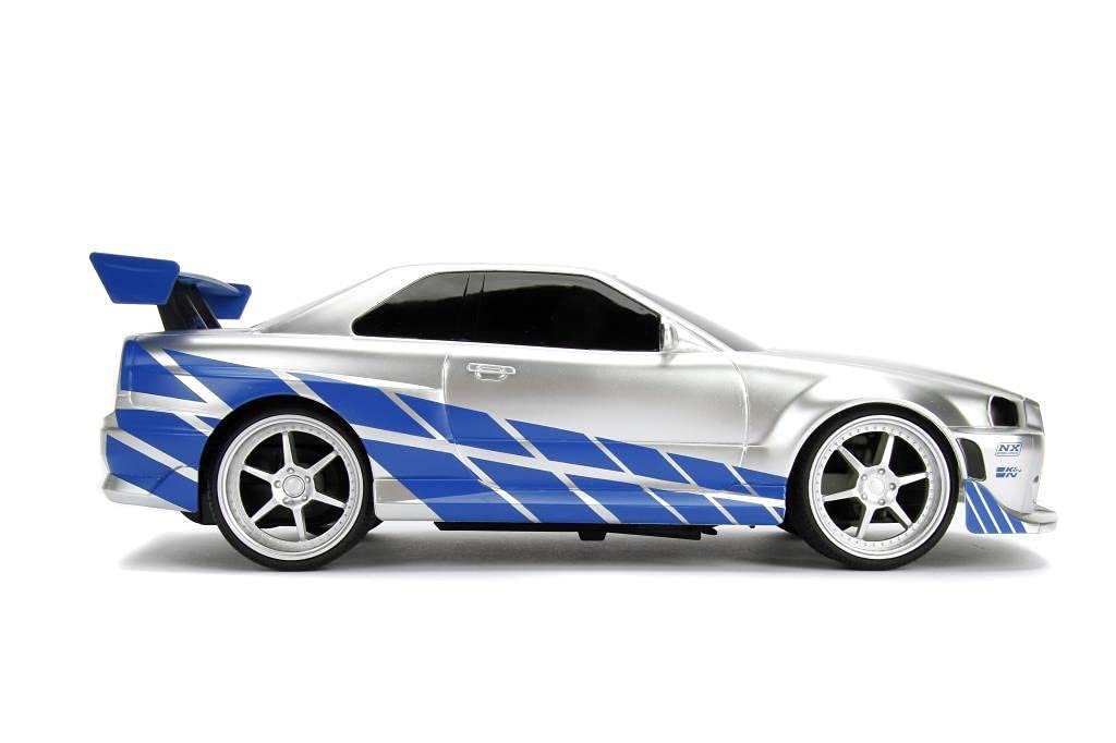 Jada Toys Fast & Furious RC samochód wyścigowy, Nissan Skyline GT-R, R34, samochód zdalnie sterowany, funkcja turbo, dwukanałowy, pilot radiowy, funkcja ładowania USB, baterie w zestawie, 1:16, 29 cm