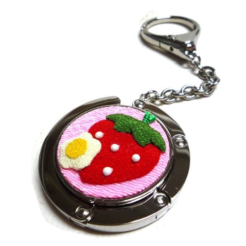 Accroche-sac fraises Tell pour ne plus poser son sac par terre