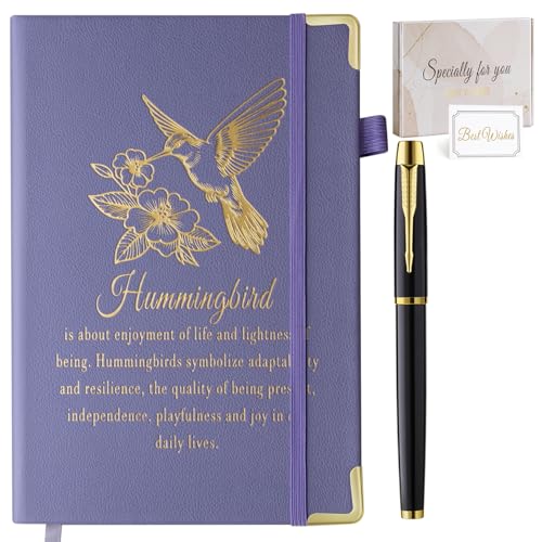 Brown leather-covered journal with an embossed hummingbird, closed with a wrap strap