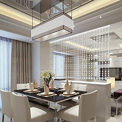 Rideaux de séparation de pièce en cristal pour structurer un studio sans perdre de lumière