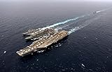 An underway replenishment with ships of the John C Stennis Carrier Strike Group Poster Print by Stocktrek Images (17 x 11)