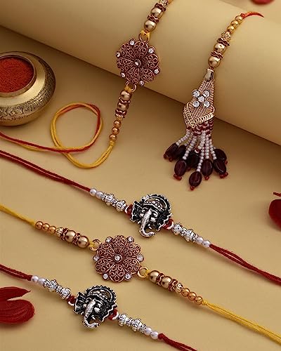 Image of Rakhi Set Of 5 Rakhi For Brother Dry Fruits Combo Pack Rakhi Gift Hamper Rakhi With Gift Small Pet Jars Pack Of 4 Dry Fruits Cashew Walnut Almond Pista Flowers Of Ganesha Rakhi Set Of 5
