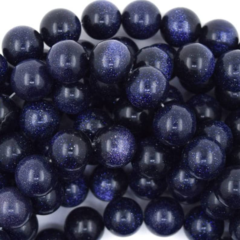 Perles Goldstone bleu polies d'un éclat intense pour joaillerie fine et colliers
