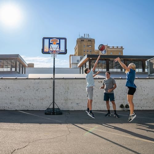 Image of Lifetime NBA New York Knicks Portable Basketball Hoop, Adjustable Height 7.5-10 Ft, 44 Inch Shatterproof Fusion Backboard, Base with Wheels