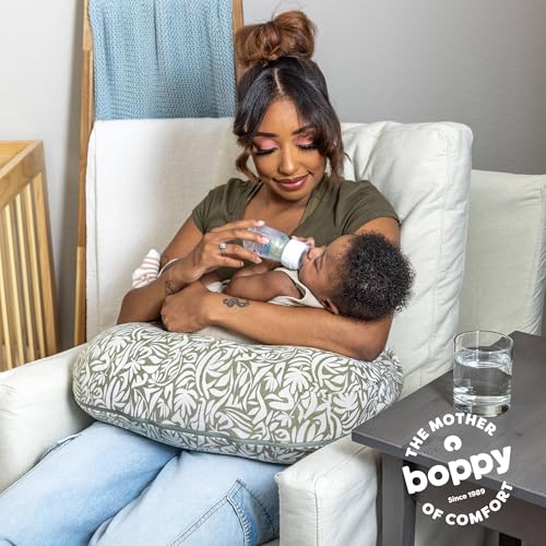 Image of Boppy Nursing Pillow - Ergonomic Bottle & Breastfeeding Pillow, Higher, Firmer & Larger, Water-Repellent with Washable Organic Cotton Cover, Baby Safety Alliance Verified - Green Cut Out Leaves
