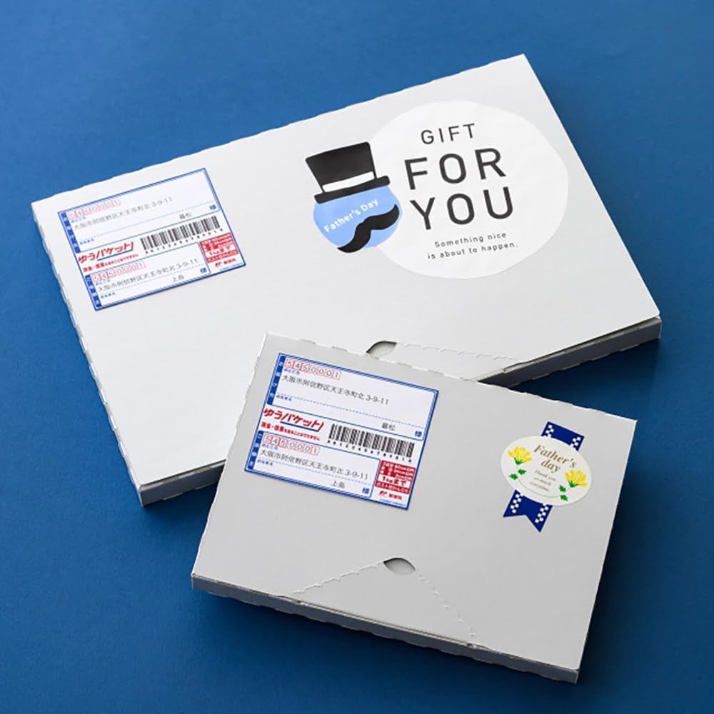 Two HEADS gift boxes, one with a Father's Day gift label and the other with a mailing label.