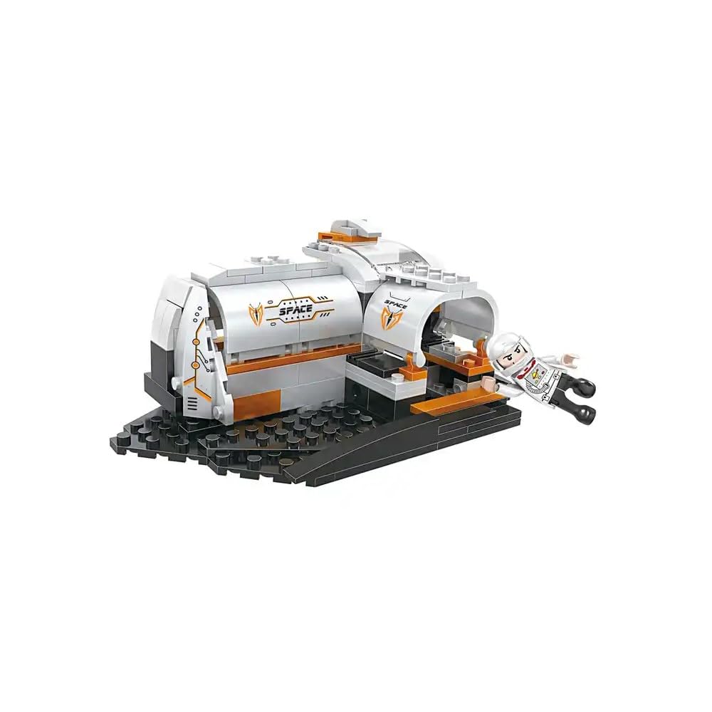 Assembled model of a white and orange space station module with an open hatch and an astronaut figure floating nearby, built from construction blocks.
