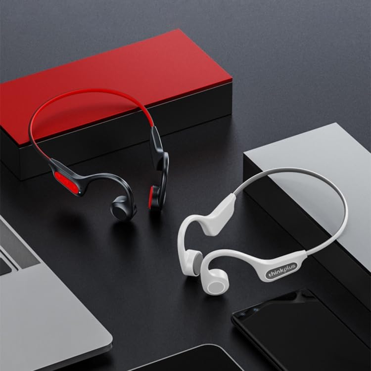 Two pairs of ELECTROPRIME Bone Conduction Earphones, one white and one black with red accents, on a desk next to a laptop and smartphone.