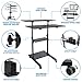 Mount-It! Mobile Desk Workstation 40 Inch Wide Large Rolling Computer Desk is Height Adjustable to 64 Inches, Sit Stand Computer Cart with Multi Level Shelves on Wheels in Black