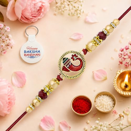 Image of Riddhika Ventures Religious Gold Plated Meenakari Sacred Ganesha Rakhi with Roli Chawal and One Happy Raksha Bandhan Keychain