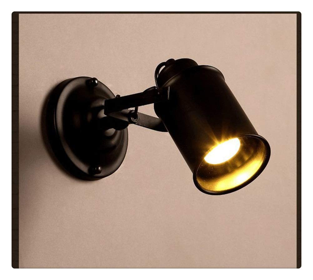 Aplique de pared retro negro con brazo oscilante ajustable para iluminar el dormitorio