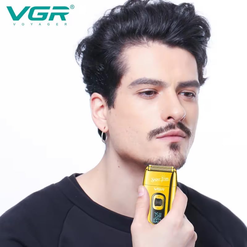 Man using the VGR V-332 shaver on his face.