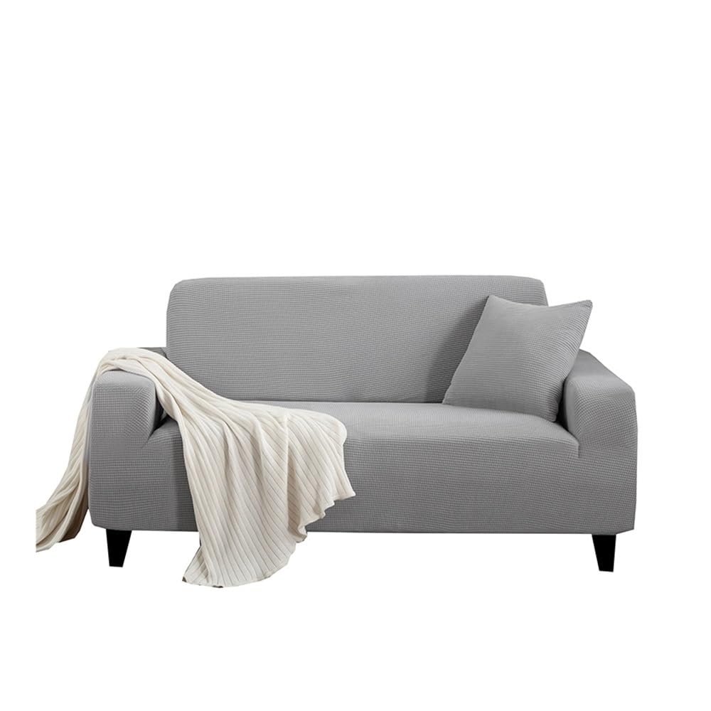 Housse de canapé extensible gris clair pour salon chaleureux et décoration cocooning