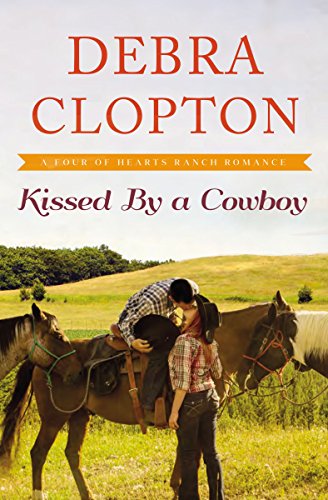 Kissed by a Cowboy (A Four of Hearts Ranch Romance Book 3) by [Debra Clopton]