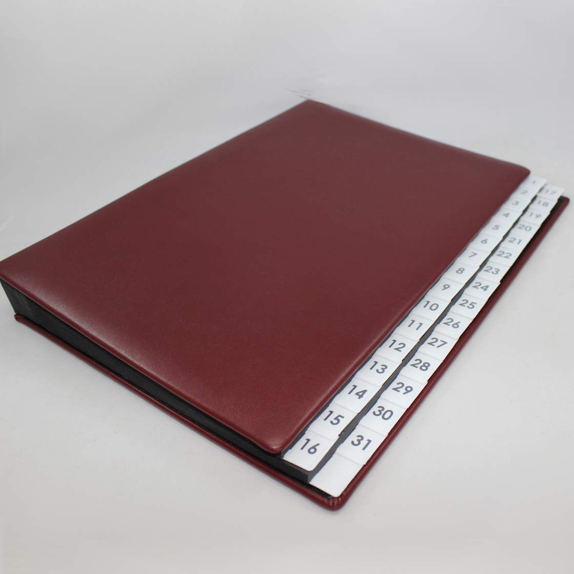 Carpeta clasificadora con registro 1-31 de piel de vacuno lisa en color rojo vino