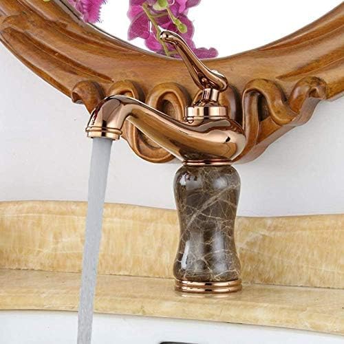 Mitigeur cascade de salle de bains rose doré au design luxueux sur pont