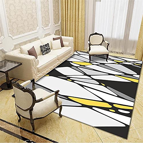 Conception graphique géométrique pour ce tapis enfant noir jaune blanc