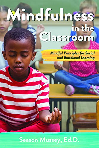 The cover of Mindfulness in the Classroom. There is an image of children meditating behind the title. 