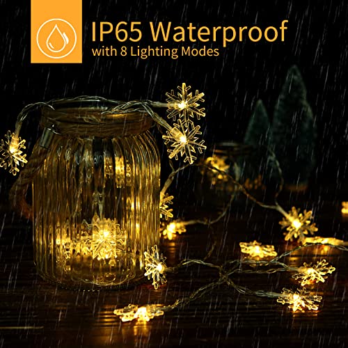 Image of Brightown Solar Christmas Snowflake String Lights 100 LED 39 FT Outdoor Waterproof Fairy Lights with 8 Lighting Modes for Wedding, Party, Tree, Room, Garden, Patio, Yard, Home, Warm White