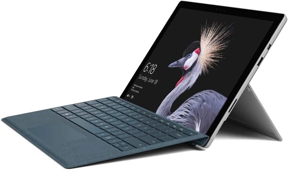 Microsoft Surface Pro with a blue Type Cover attached, set up in laptop mode with the kickstand extended.