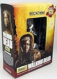 La figurine de Michonne est en résine métallique mesure 9 cm est peinte méticuleusement à la main. Elle la représente tenant son sabre en l'air, prête à frapper. Les têtes de deux rôdeurs décapités sont étendues à ses pieds. Leurs mâchoires sont manquantes ce qui indique que ce sont les deux rôdeurs que Michonne a enchaîné et rendu impuissants à coup d'épée. La figurine est livrée dans une magnifique boite et contient une brochure exclusive regorgeant d'informations: dans ses 12 pages retraçant le parcours de Michonne. Une pièce de collection indispensable pour tous les fans de la série The Walking Dead.
