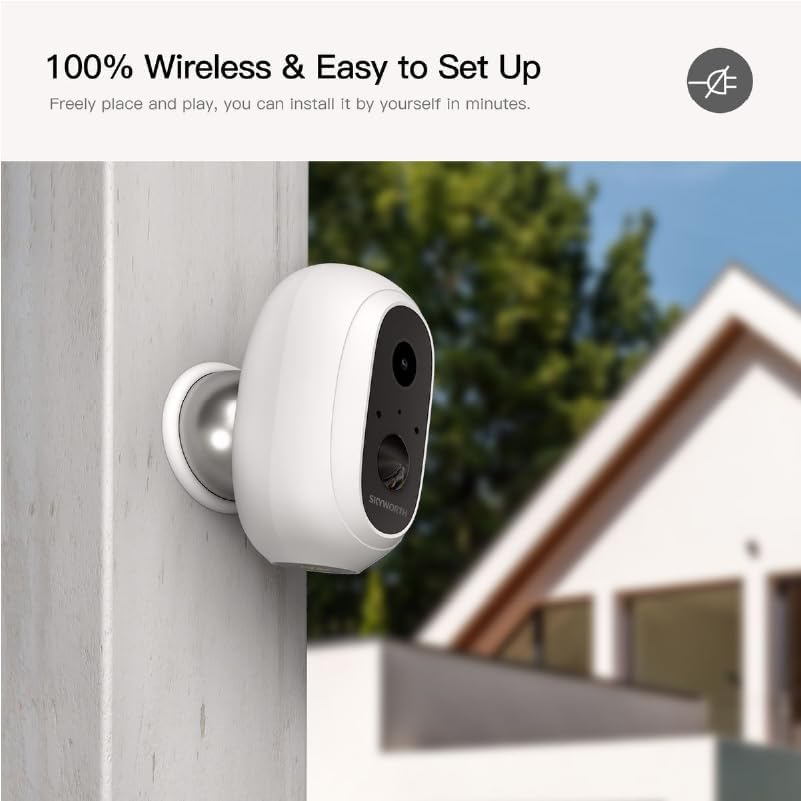 Skyworth Camera-B-ADDON mounted on a white wall outdoors, with a house and trees in the background, illustrating its wireless and easy setup.