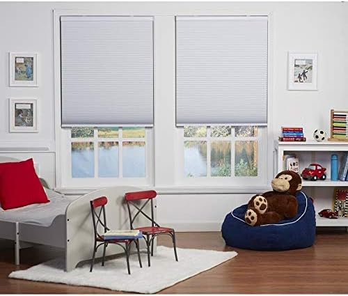 Two white blackout cordless cellular shades installed in a child's bedroom