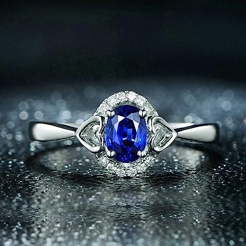 Bague en Argent 925 d'exception ornée d'une zircone bleue ovale et de cœurs