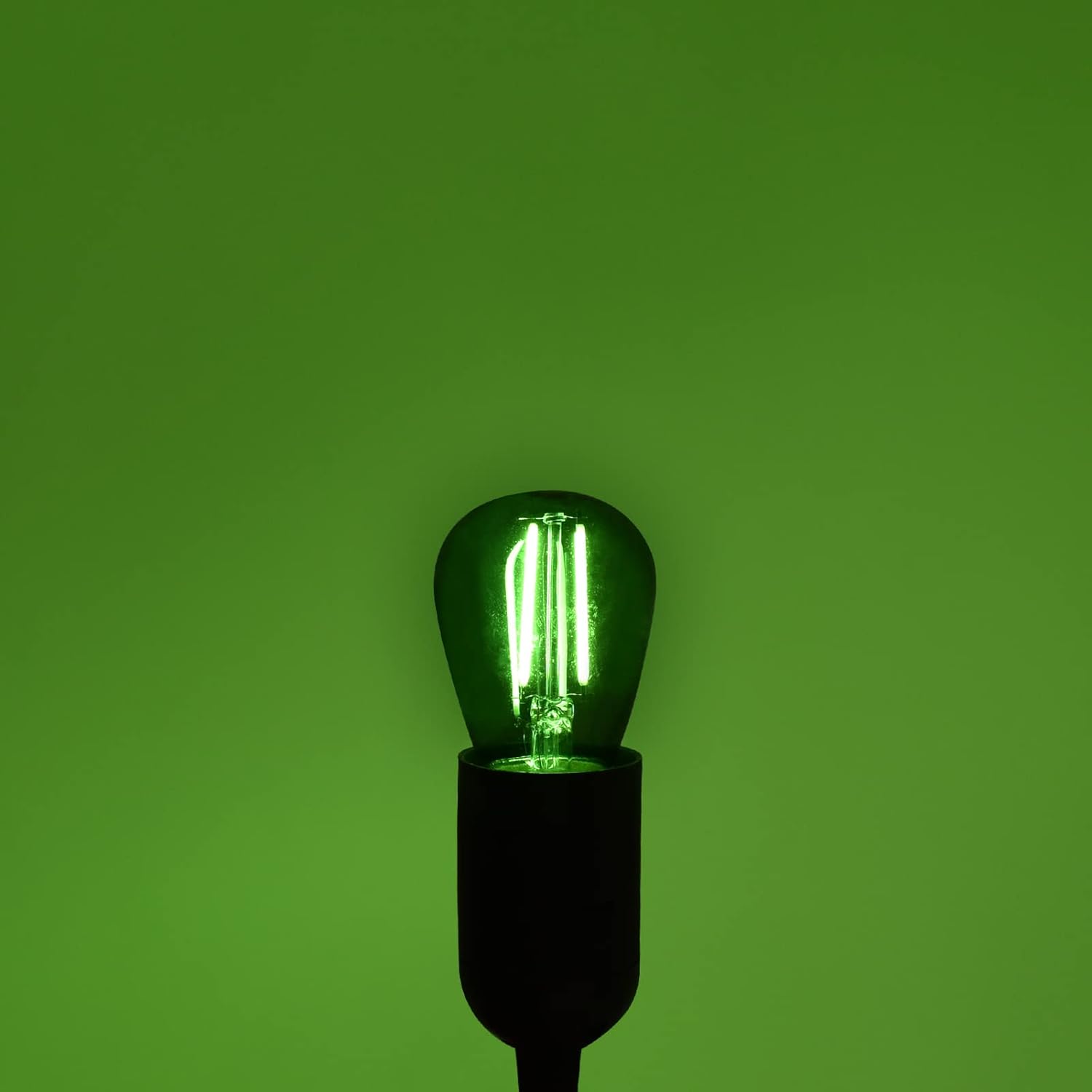 Single LUXRITE S14 LED Green Light Bulb illuminated