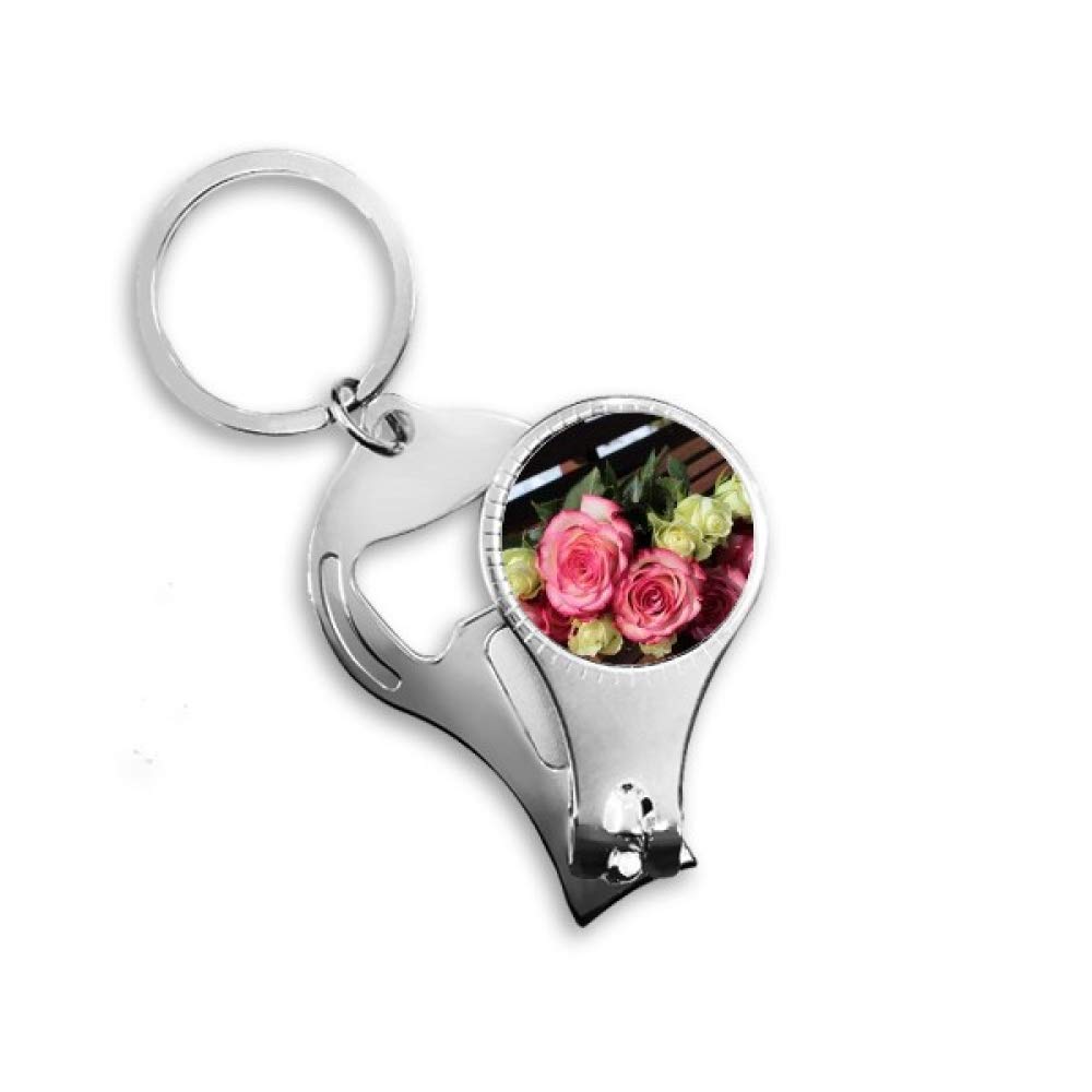 Tire-bouteille à ongles élégant avec fleurs roses et blanches pour table