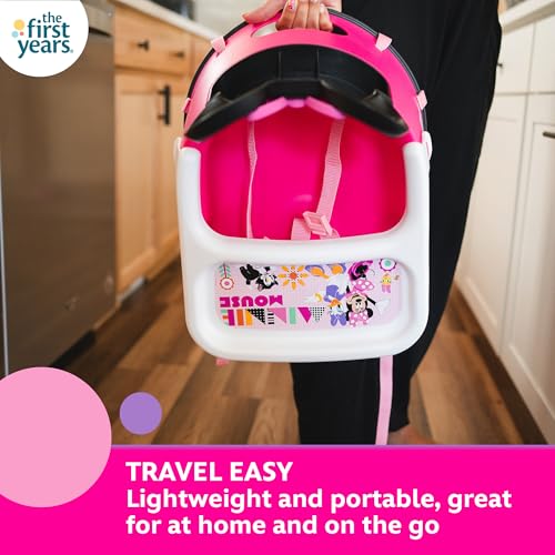Image of The First Years Disney Minnie Mouse Booster Seat for Kitchen Chair- Includes Removable Tray - Contoured Toddler and Baby Seat with 3-Point Harness for Mealtime - Lightweight Travel Booster Seat