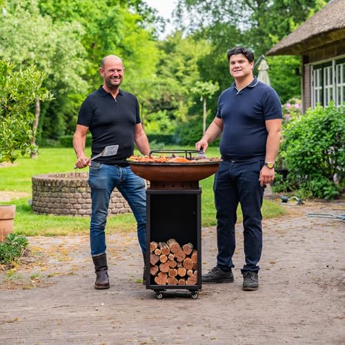 Barbacoa Camarada de acero corten Blackline 2.0, con atizador de madera y almacenamiento de madera, diámetro de 70 cm