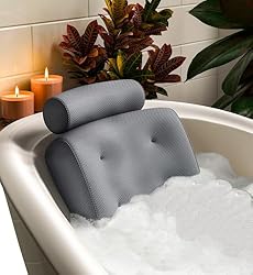Gray bath pillow in suds with purple loofah shown