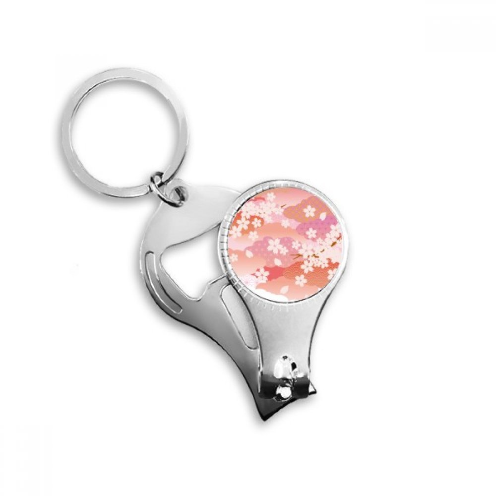 Décapsuleur porte-clés motifs nuages et fleurs de cerisier rose compact