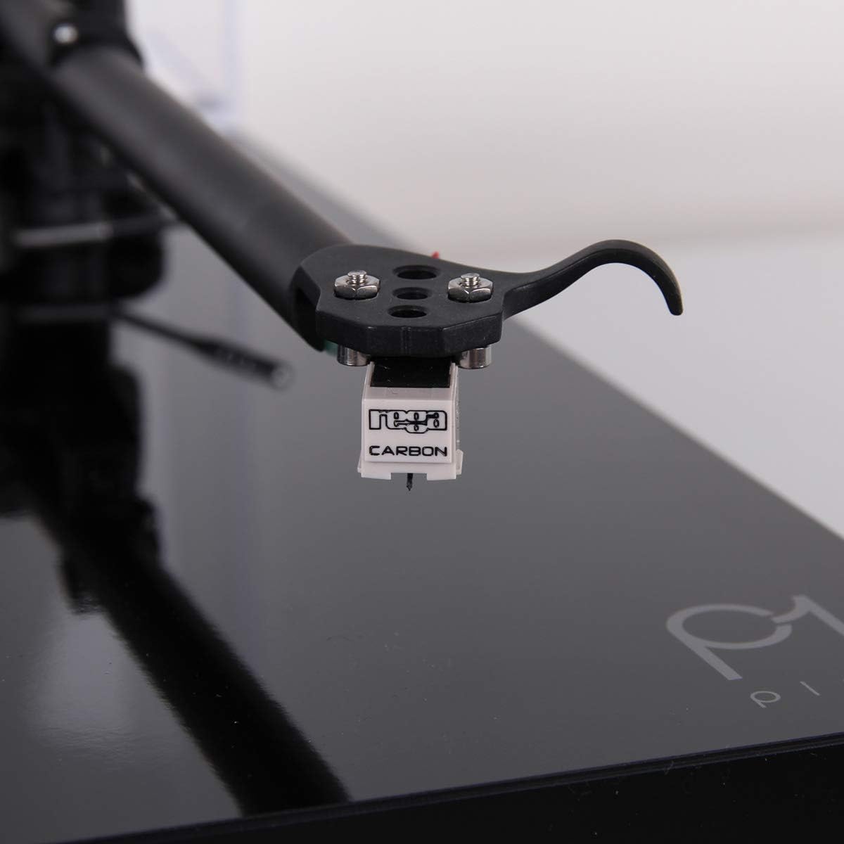 Close-up of Rega Carbon MM cartridge on tonearm