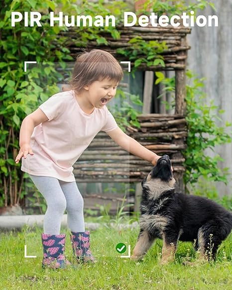 A young child playing with a puppy in a garden, with a white square overlay indicating PIR Human Detection