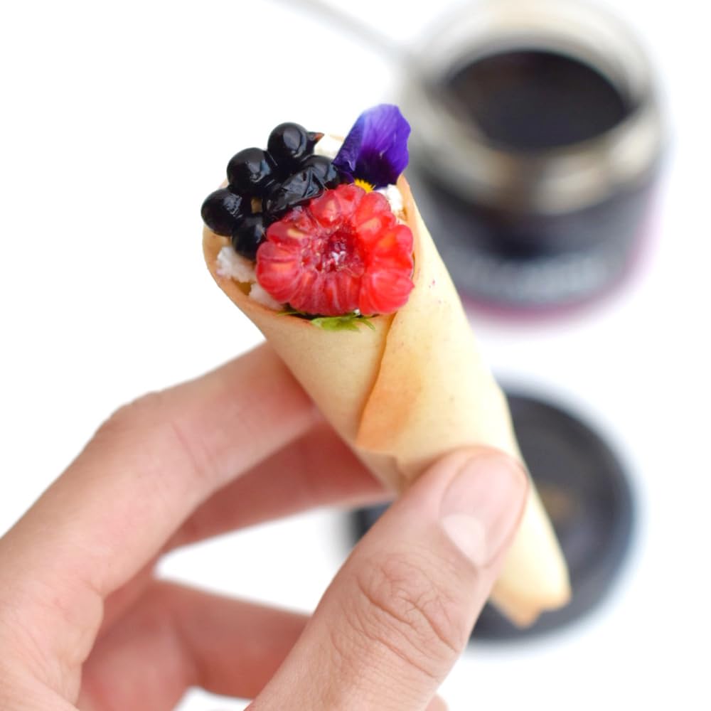 Perles de Vinaigre de Modène Gourmet pour Vinaigrette ou Décoration pot 200gs. Les sphères de vinaigre de Modène dans son intérieur liquide explosent dans la bouche lorsqu'elles sont mordues.