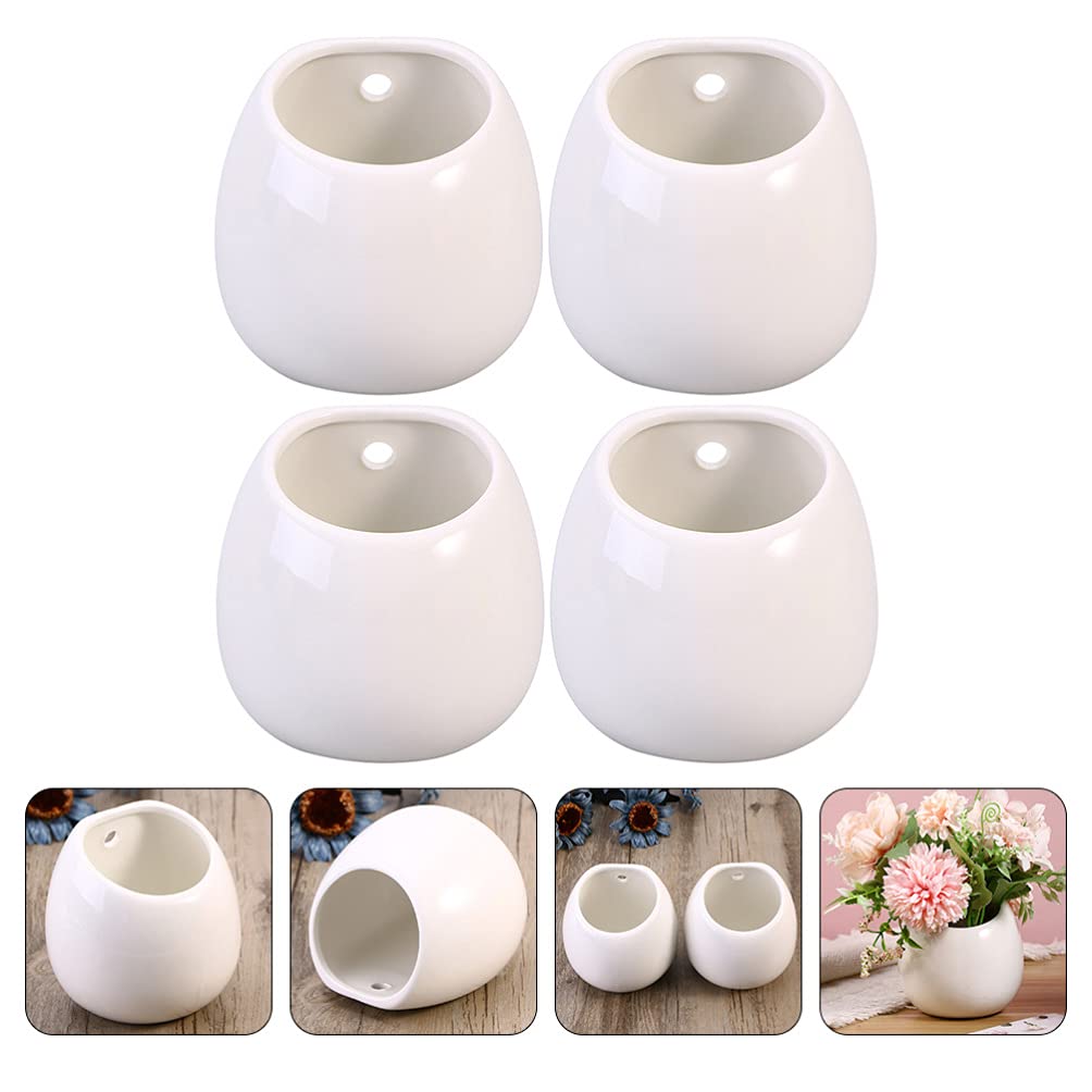 Białe ceramiczne doniczki ścienne, okrągłe wiszące uchwyty na rośliny, mini wazony ścienne do sukulentów, wewnętrzne donice cylindryczne, dekoracyjne dekoracje ścienne.