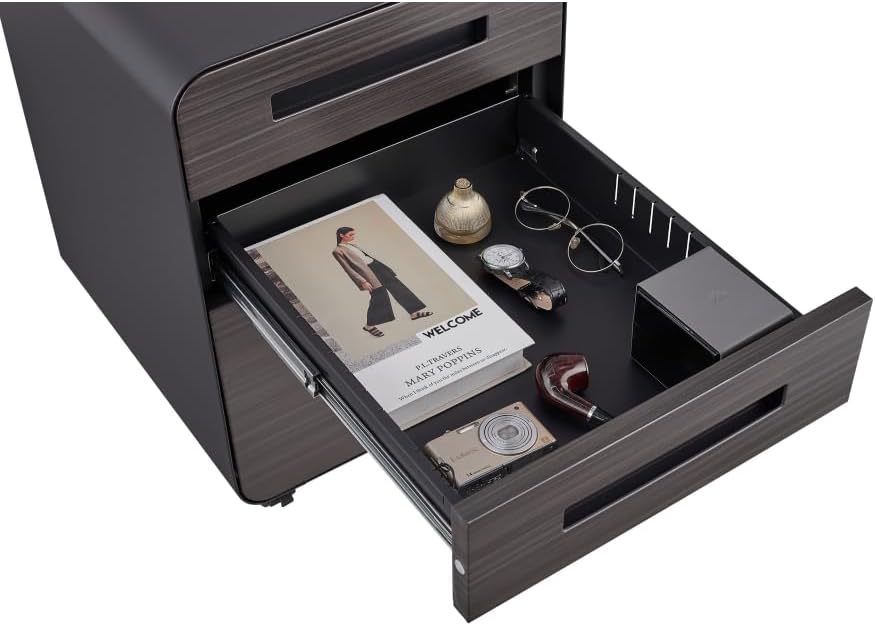 Top drawer of the filing cabinet open, showing a pencil tray with various office supplies like a book, watch, and glasses.