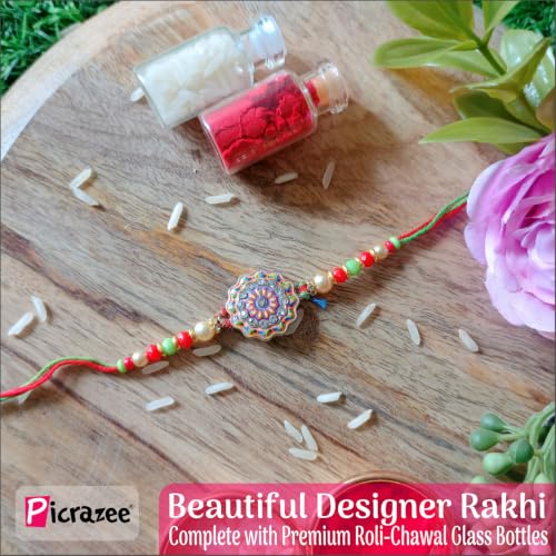 Image of PICRAZEE Raksha Bandhan Gift for Brother - Rakhi, 12 inch Cushion with Filler, Mug, Table Standy, Roli-Chawal Bottles, Keyring, Fridge Magnet & Greeting Card (Best Brother)