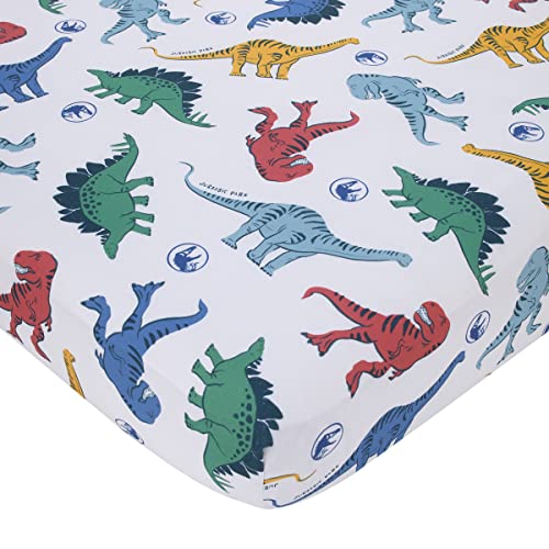 Image of NoJo Universal Jurassic World Wild and Free Blue, Green, and Yellow Dinosaur 4 Piece Toddler Bed Set - Comforter, Fitted Bottom Sheet, Flat Top Sheet, Reversible Pillowcase