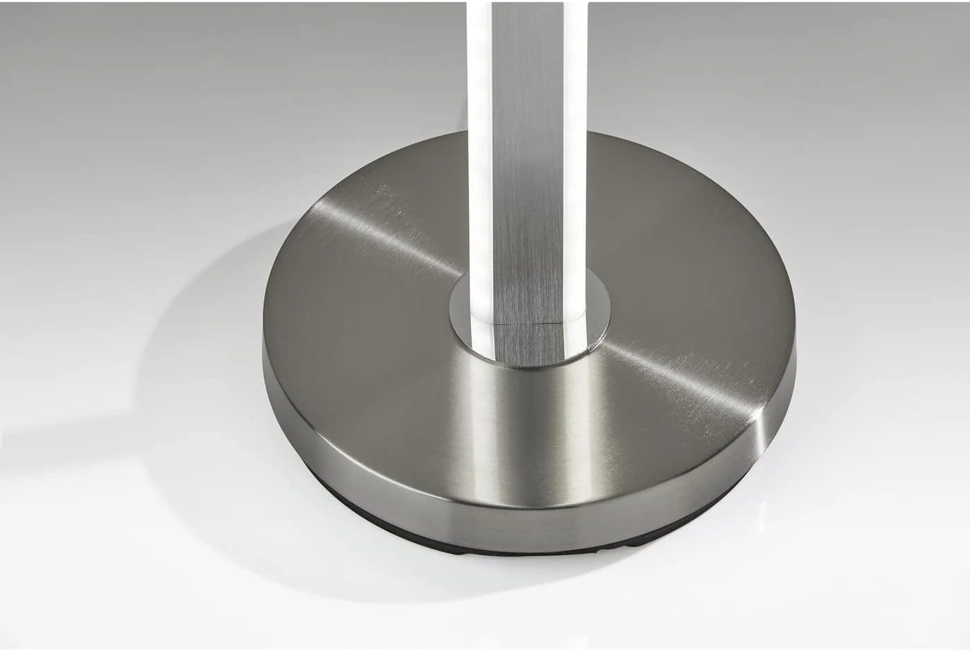 Fèmen view of the round brushed steel base of the Adesso Marla LED Wall Washer Floor Lamp.