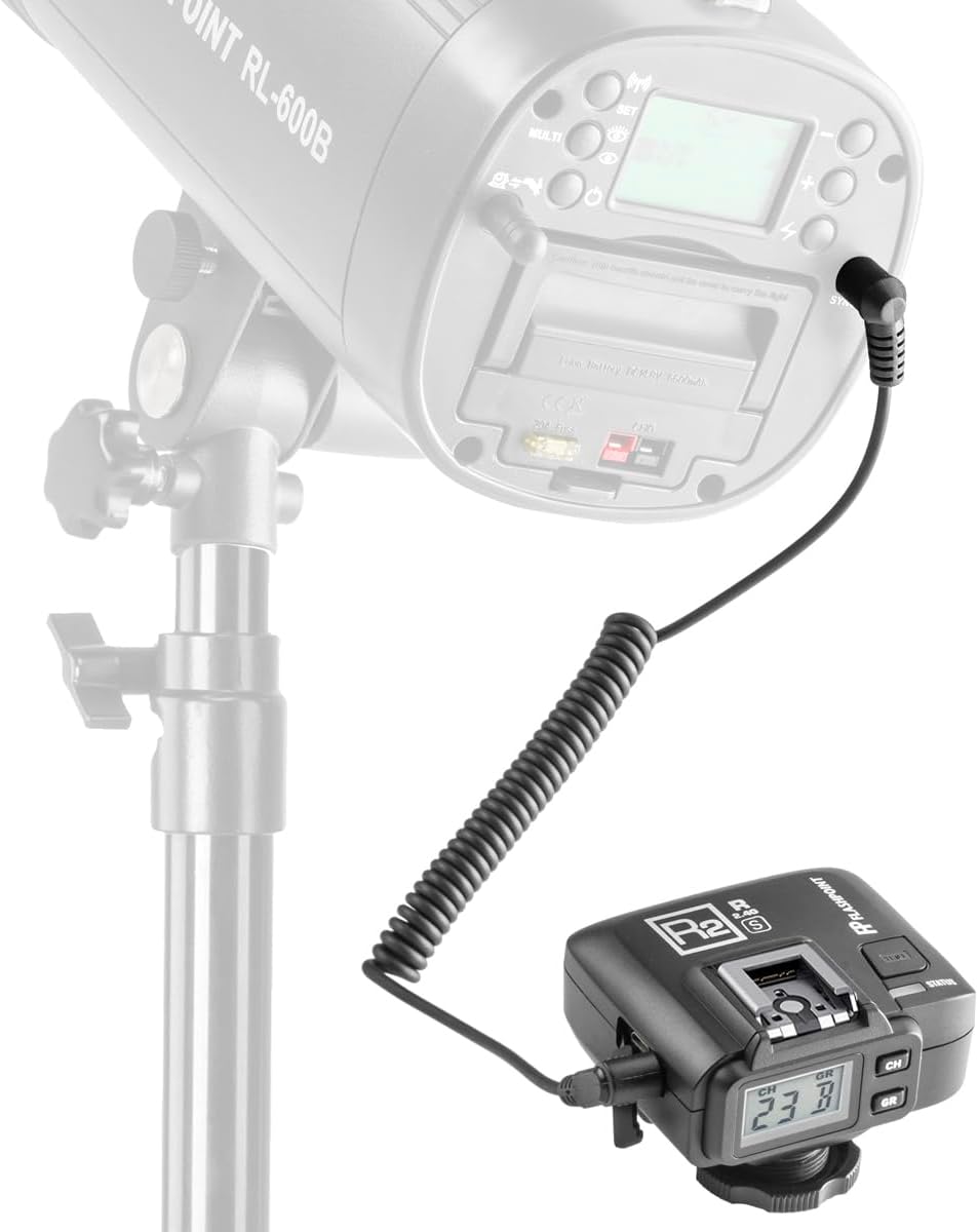 Flashpoint R2 receiver connected to a studio strobe via a coiled sync cable.