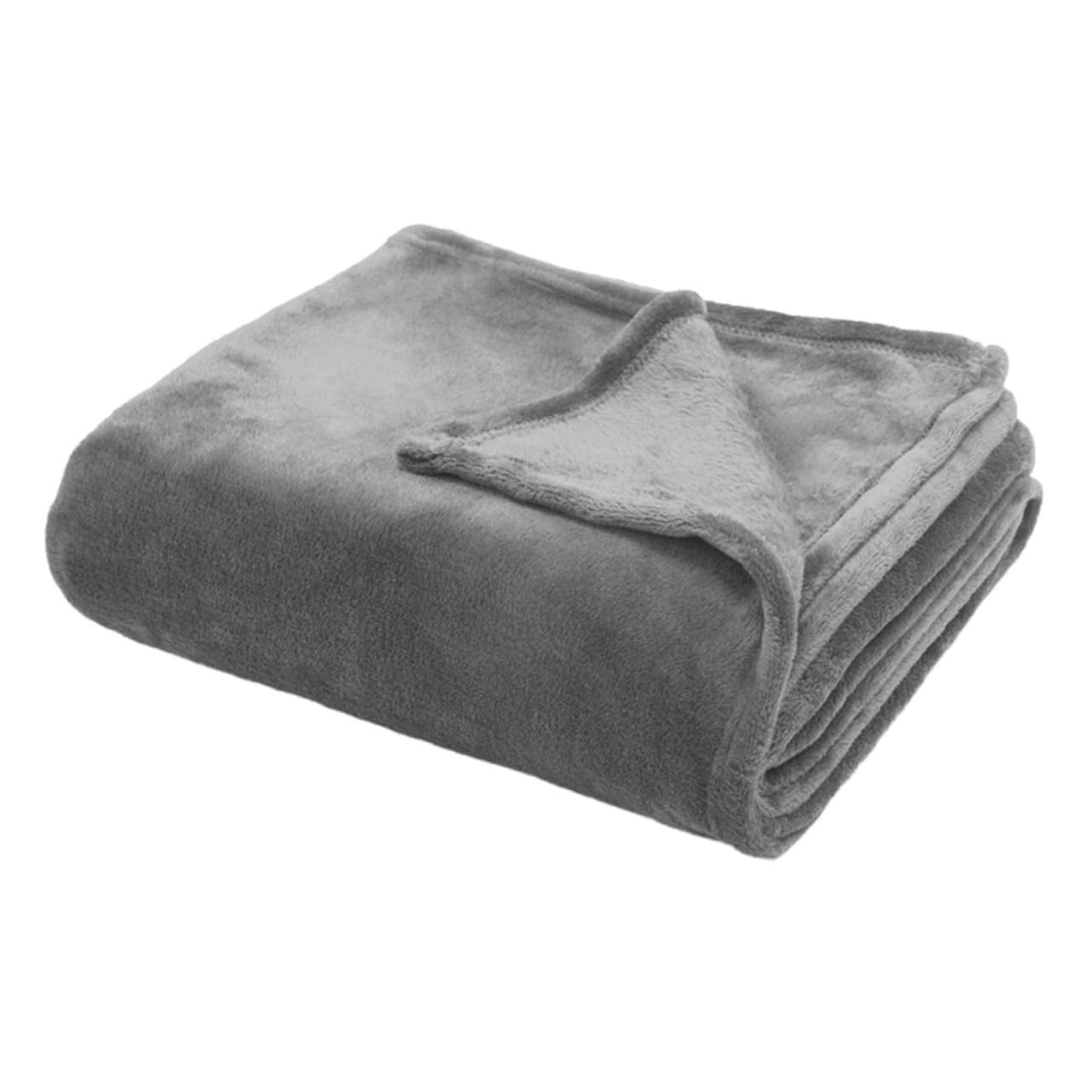 Couverture flanelle douce pour soirée cocooning sur canapé et nuits fraîches