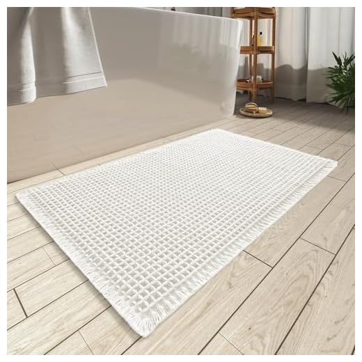 AMOAMI Upgraded Waffle Bath Mat, Super Absorbent Non Slip Bath Mats for Bathroom Floor, Machine Washable Bathroom Rugs with Tassels, Rubber Backed Bathroom Mats, Ultra Soft, 17" x 24", White