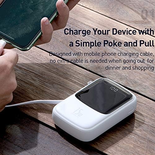 A hand holding a smartphone connected to the Baseus Qpow Power Bank via its integrated USB-C cable, demonstrating charging.