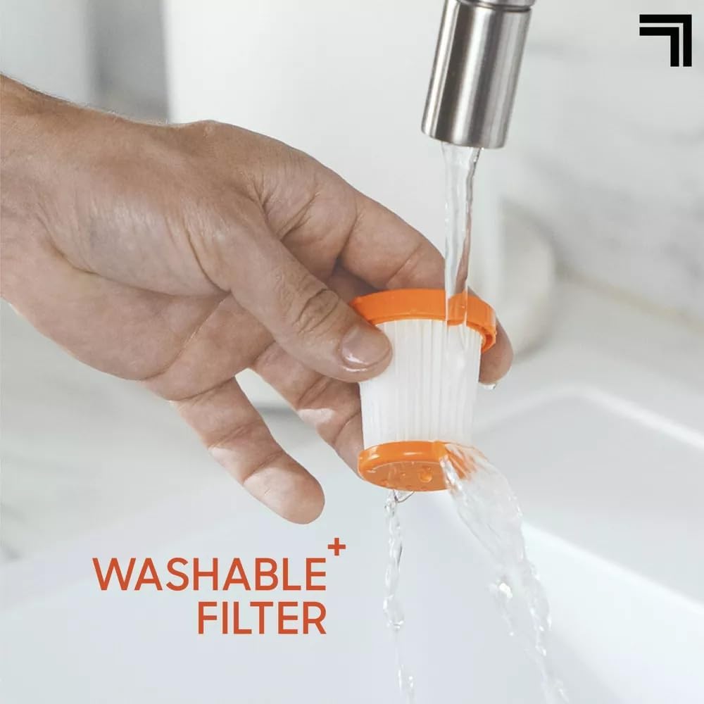 Hand rinsing the washable filter of the Sharper-Image Handheld Vacuum under water