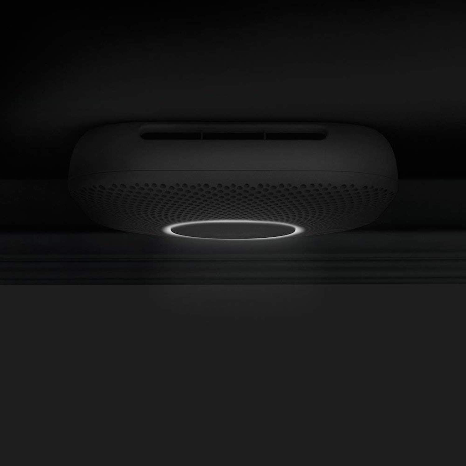 Smartphone screen showing the Google Home app interface for Nest Protect, displaying device status and settings.