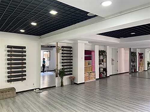 Support mural tapis de yoga pour optimiser le rangement des petits studios
