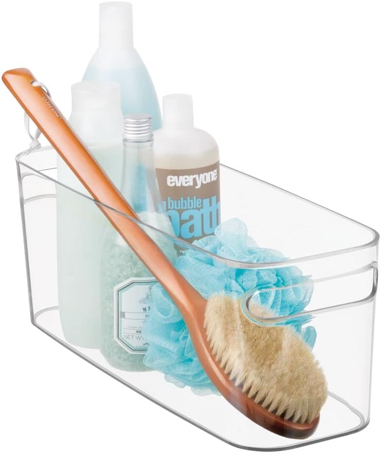 mDesign Large Plastic Storage Bin filled with bath products and a brush